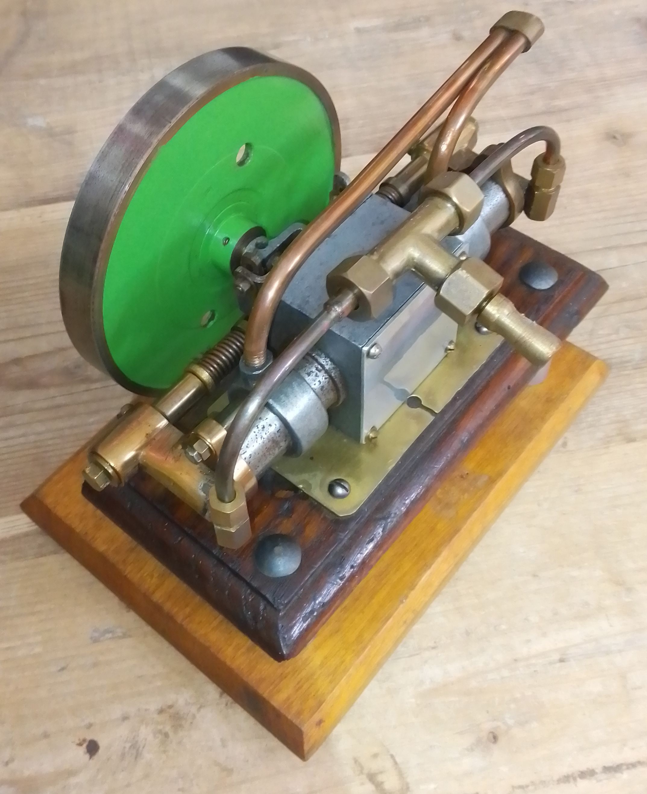 A scratch built live steam horizontal opposed cycler engine with wooden case