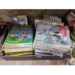 A box of assorted cycling ephemera including 1960s Coureur magazines, 1960s International Cycle