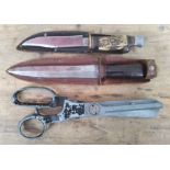 Two hunting knives & a pair of pinking shears.