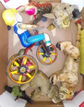 A group of six vintage wind up toys comprising a goose, an elephant, a bird, a tiger, a child on