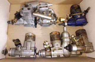 A group of six assorted radio control model aeroplane engines comprising a Taipan TS 40, a