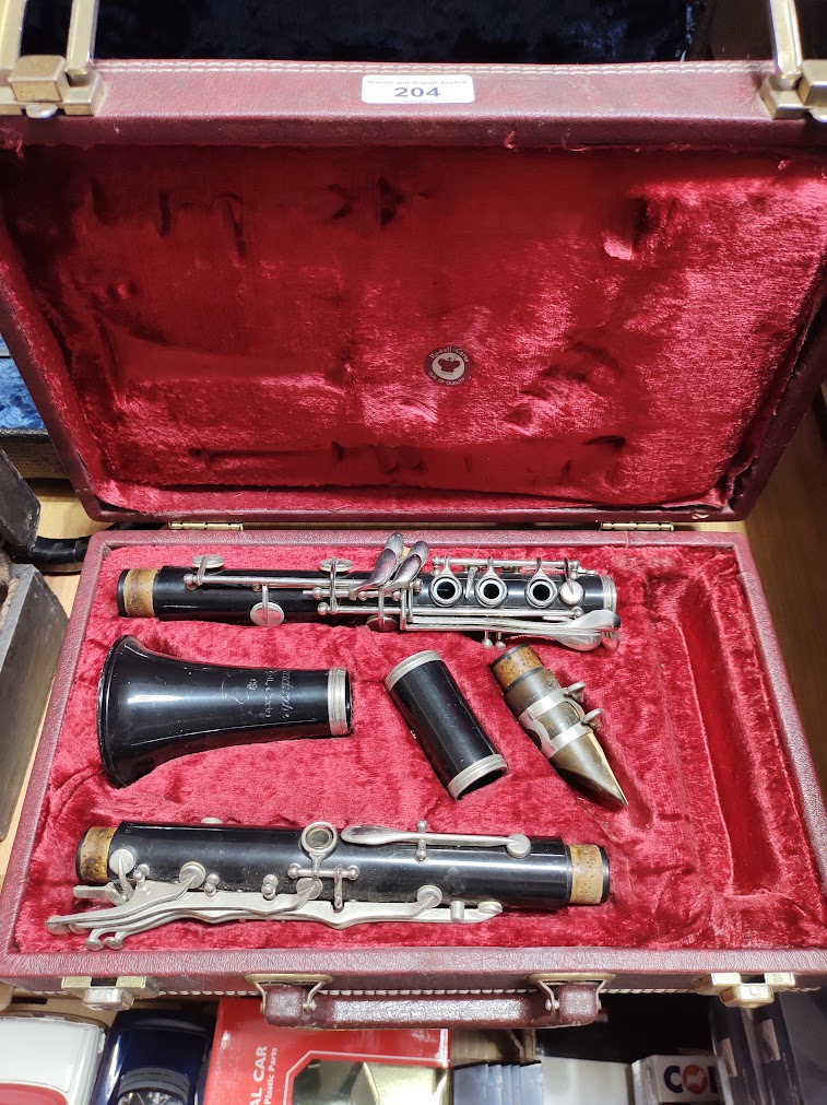 A Rudall Carte clarinet, serial no.1077018, with hard case.