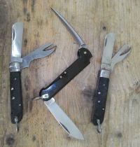 Two Italian army penknives and a German Naval pen knife.