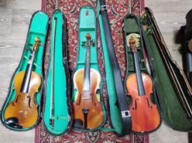Three Chinese Skylark student violins, each with bow and hard case.