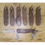 A group of seven Dutch army pen knives by Amefa and Instalex.