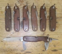 A group of seven Dutch army pen knives by Amefa and Instalex.