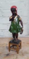 A cold painted bronze modelled as a young girl, height 36.5cm.