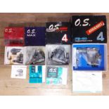 A group of four OS radio control model aeroplane engines comprising OS Pet, OS Max, OS Surpass and