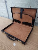 A black leather Hilton Collection executive case by Papworth Industries (Swaine Adeney Brigg),