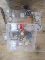 A box of Omega watch parts.