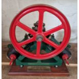 A well engineered model of a live steam double diagonal stationary engine on wooden base, size of