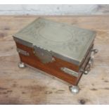 A silver plated oak tea caddy, circa 1900, the tope engraved with butterflies and acorns.