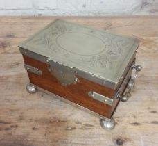 A silver plated oak tea caddy, circa 1900, the tope engraved with butterflies and acorns.