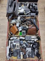 Two boxes and a hard case of cameras binoculars and accessories including Nikon & Canon 35mm