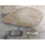Neolithic stone tools comprising a large axe head, length 22cm, a small polished rectangular axe