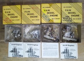 A group of four PAW radio control model aeroplane diesel engines.