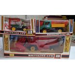 Three Britains diecast models comprising of a 9570 Combine Harvester, a 9569 Tractor Lorry & a