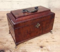 A George II mahogany tea caddy with herringbone cock beading, brass handle and feet.