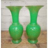 A pair of French 19th century opaline green and gilt glass baluster vases with flared rims, ovoid