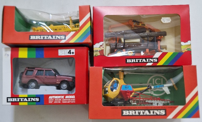 Four Britains diecast models comprising of a 9480 Land Rover Discovery, a 9533 Log Transporter, a