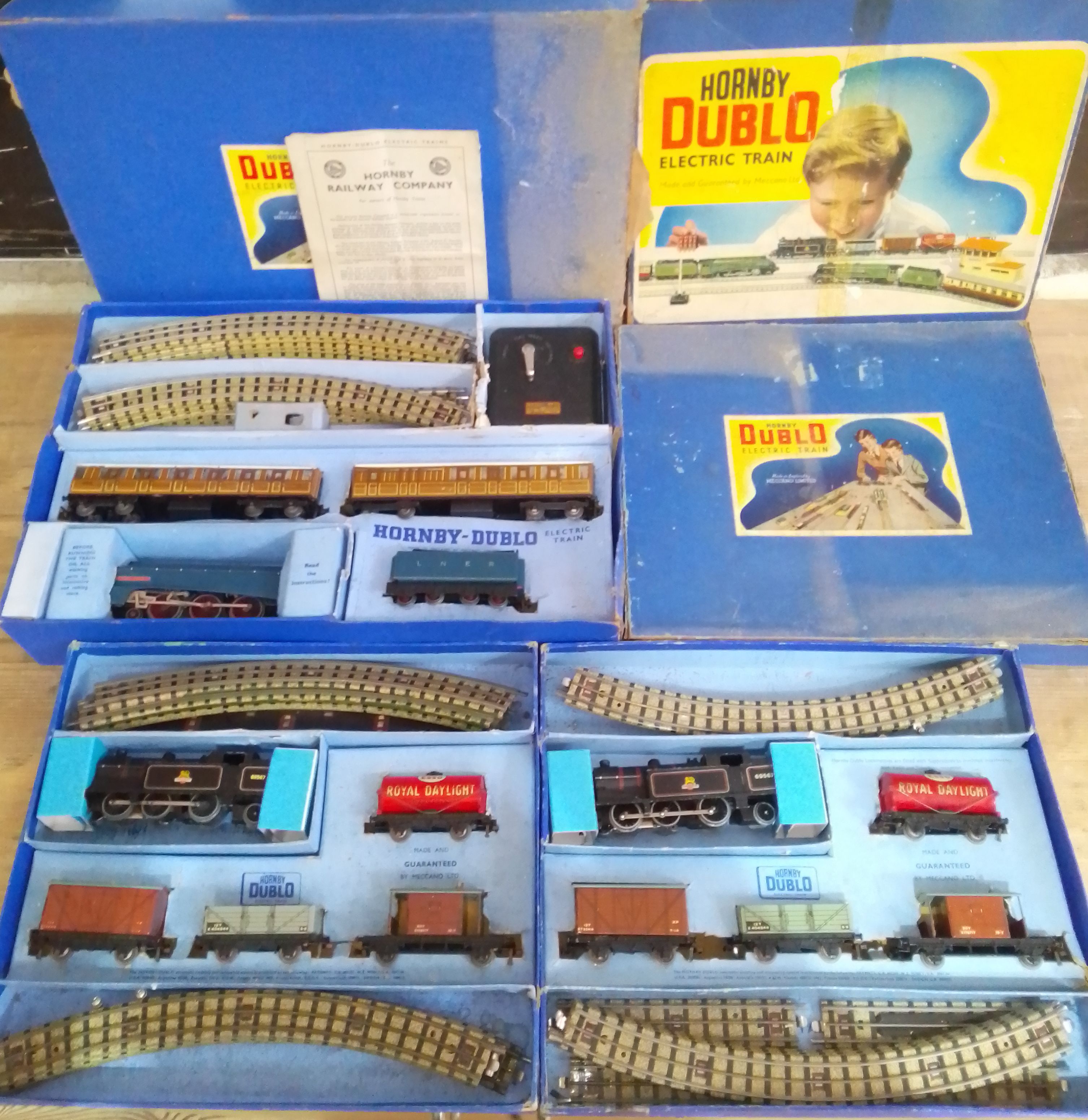 A group of three Hornby Dublo 3 rail electric train sets comprising a Sir Nigel Gresley and two