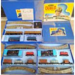 A group of three Hornby Dublo 3 rail electric train sets comprising a Sir Nigel Gresley and two