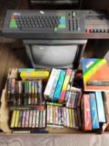Amstrad CPC 464 computer together with Amstrad CTM 644 colour monitor and a box of various games,
