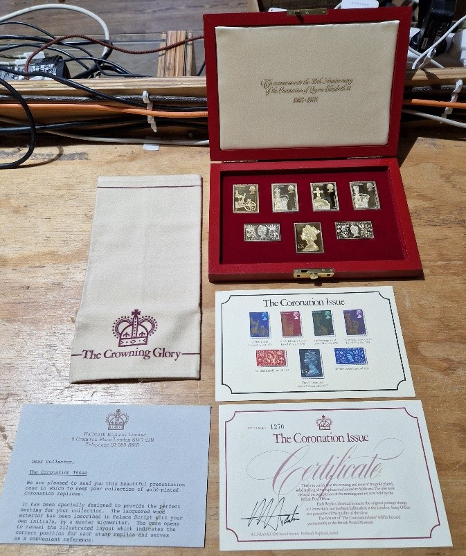 A limited edition coronation issue of gold plated solid silver stamp dies (1270 of 5000), with