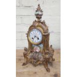 A French late 19th century ormolu and porcelain mantle clock.