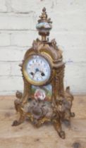 A French late 19th century ormolu and porcelain mantle clock.