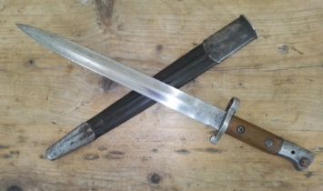 A British 1903 pattern bayonet by Mole, leather scabbard.