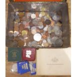 A tin of assorted coins.