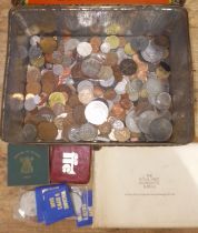 A tin of assorted coins.