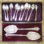 Assorted silver teaspoons and a pair of EPNS berry spoons.