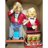 Two Japanese mechanical tinplate toys comprising of a seated man with cigar & a bartender, both