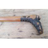 An antique walking stick, the handle modelled as a boot with brass eyelets, length 87cm.