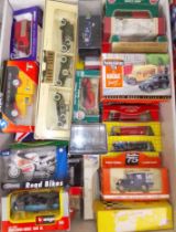 A box of assorted boxed die-cast model vehicles.