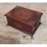 An Edwardian inlaid mahogany box with cast brass handles and feet.