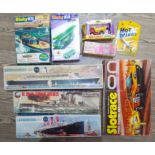 A box of assorted toys including a Triang die-cast Mini Hi-Way Rally Car Series, unbuilt Dinky and