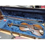 A German 19th century violin, one piece back, length 355mm, with bow stamped Homa, in hard case.