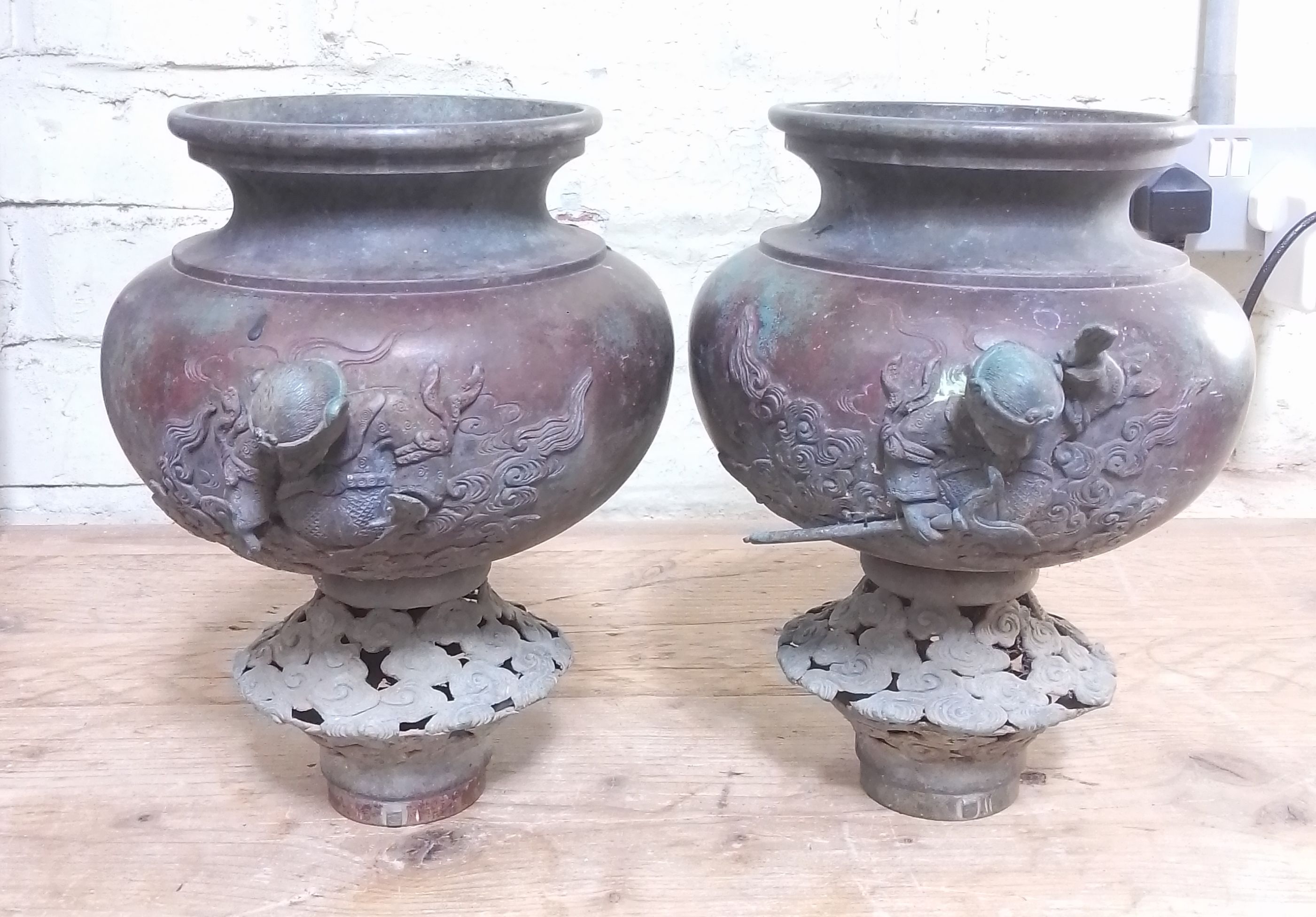 A pair of Chinese bronze vases or incense burners, bayonet fittings, possibly off a chariot or