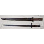 An American 1913 pattern bayonet by Remington, leather scabbard, Stamped Remington 1917....