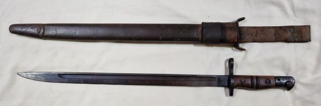 An American 1913 pattern bayonet by Remington, leather scabbard, Stamped Remington 1917....