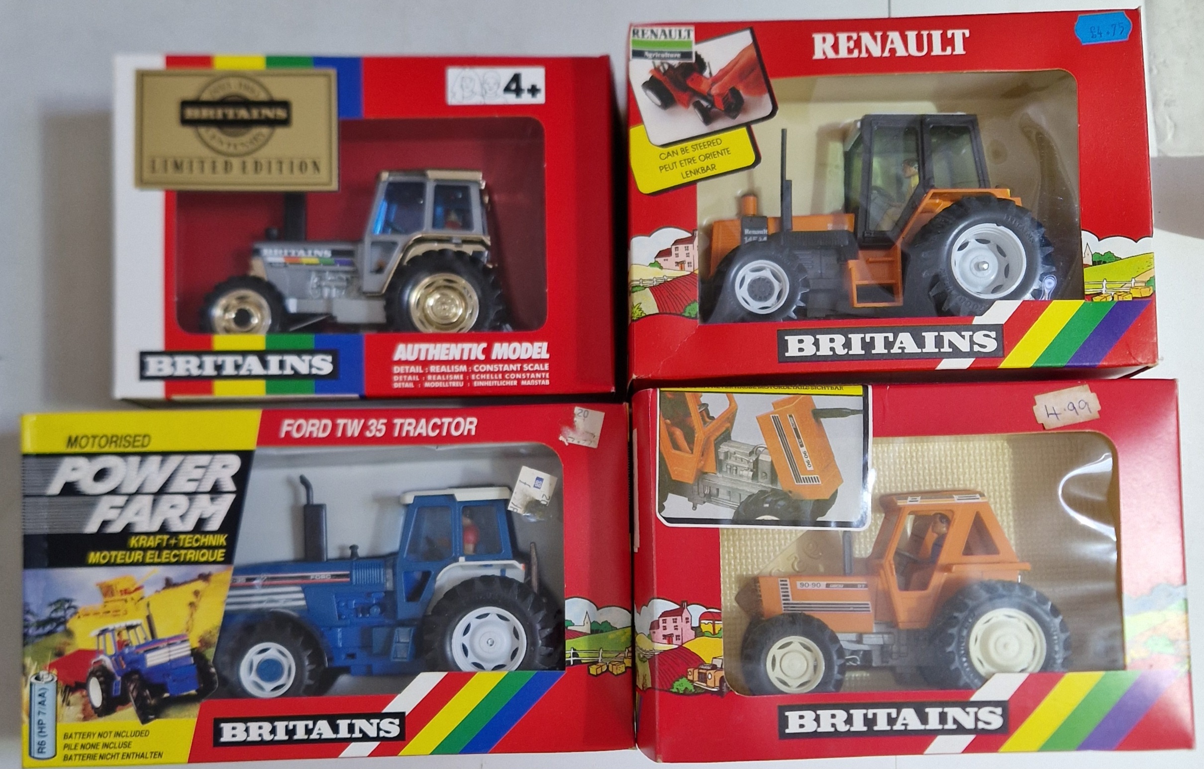 Four Britains diecast models comprising of a 5892 Tractor, a 9321 Tractor, a 9522 Renault