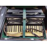 A Geraldo accordion in hard case.