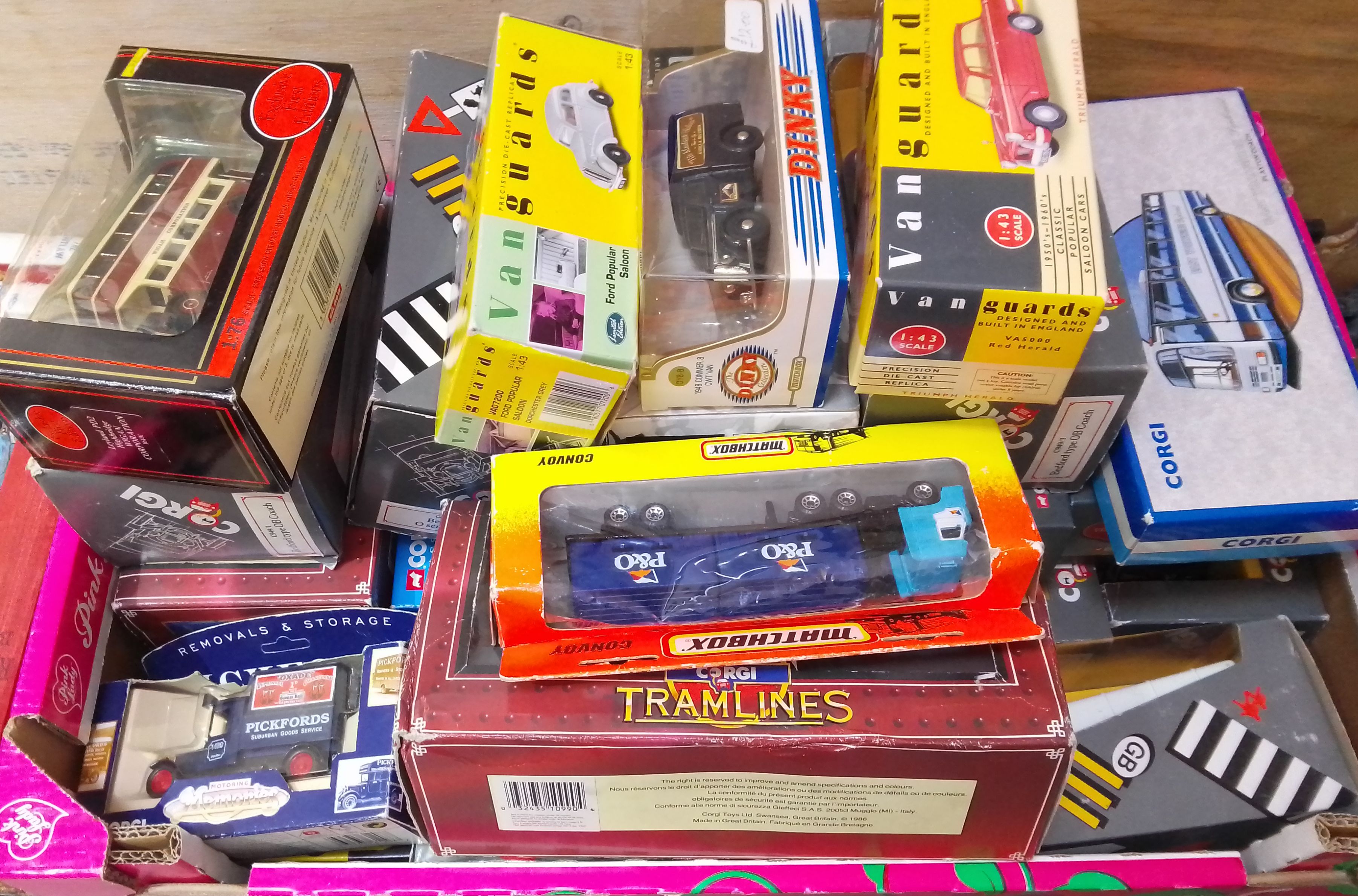 A box of assorted boxed die-cast vehicles.