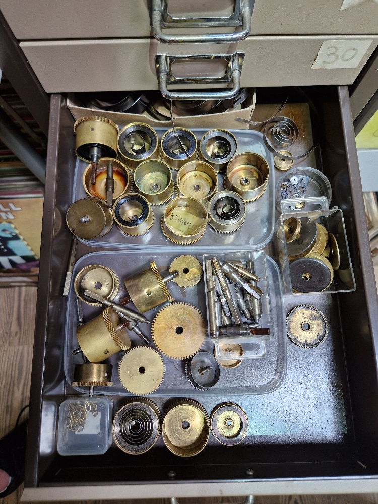 A 15 drawer triumph metal cabinet and contents comprising of clock making spares. - Image 9 of 16