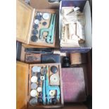 A box of mainly assorted horologist's spares and tools.