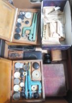 A box of mainly assorted horologist's spares and tools.
