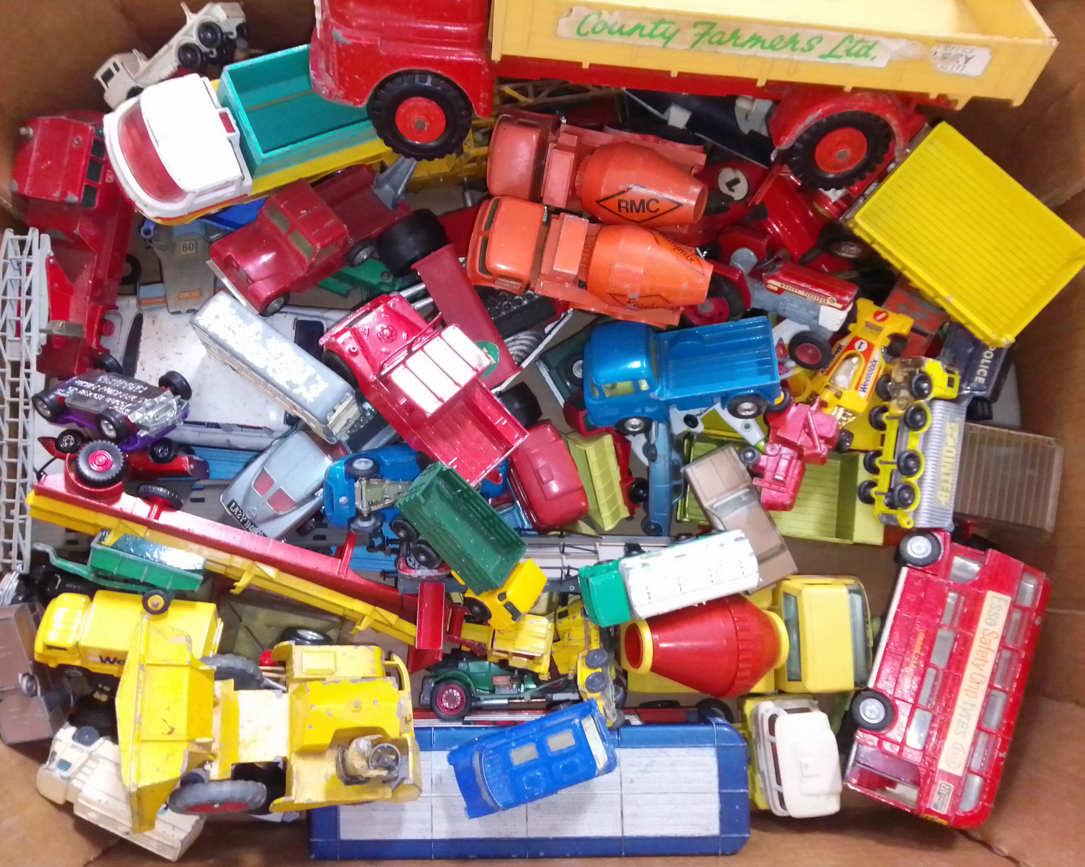 A box of assorted die-cast model vehicles including Triang, Lone Star, Dinky, Matchbox, Corgi.